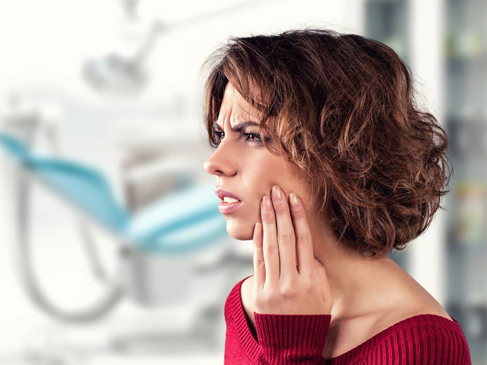 Woman experiencing tooth pain