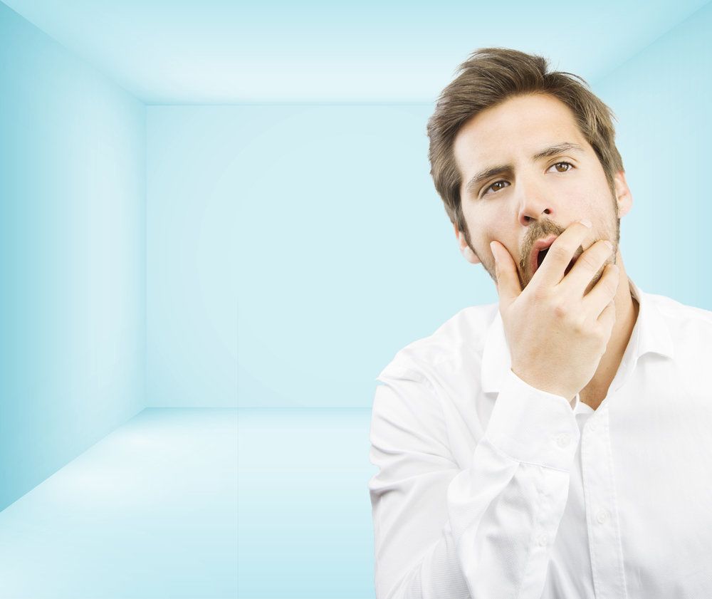 Man holding his jaw