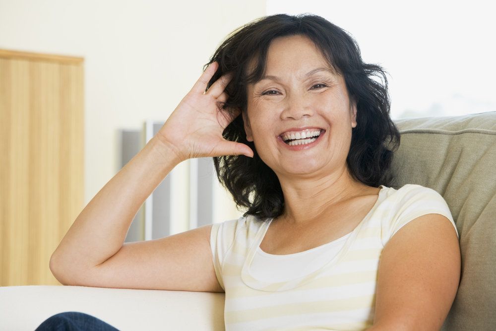 Laughing woman on couch