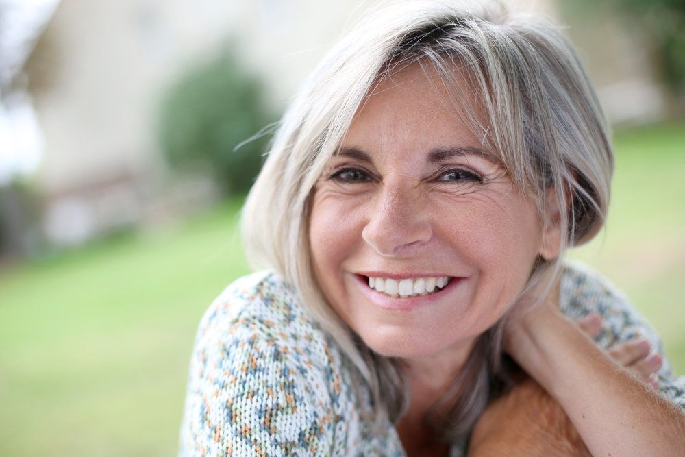 Smiling woman with gray hair