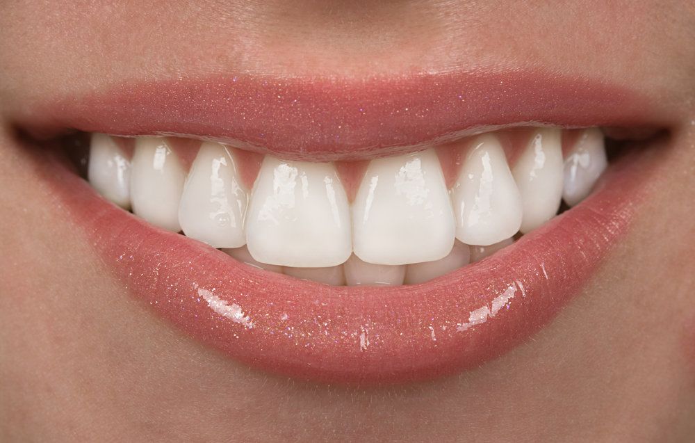 Close up of woman's sparkly lips and teeth