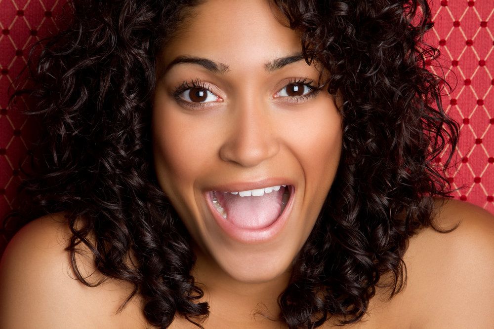 Woman smiling with mouth open
